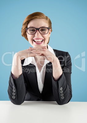 Smiling businesswoman on desk