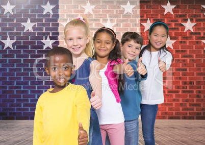 Children doing thumbs up gesture with France national flag in background