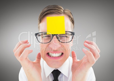 Frustrated man with sticky note on his forehead