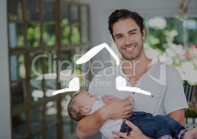 Father holding his baby at home