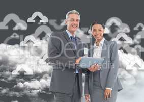 Happy businessman and businesswoman using digital tablet