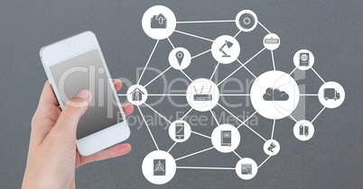 Hand holding mobile phone with networking icons on grey background