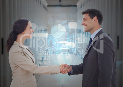 Businessman and woman shaking hands each other in office corridor
