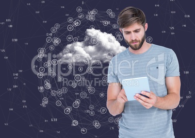 Man using digital tablet with connecting icons and cloud in background