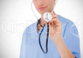 Doctor holding a stethoscope against white background