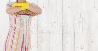 Cleaner standing with mop against wooden background