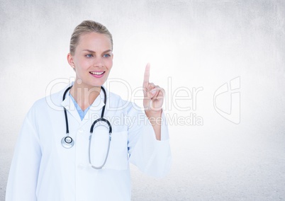Female doctor pretending to touch an invisible object