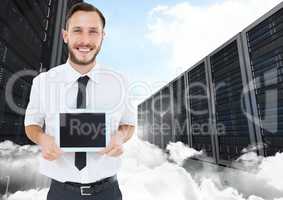 Man holding digital tablet against data center in background