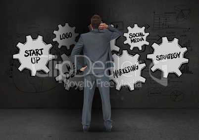 Digitally generated image of business professional looking at the blackboard