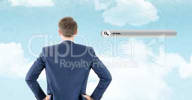 Rear view of businessman standing with website search bar