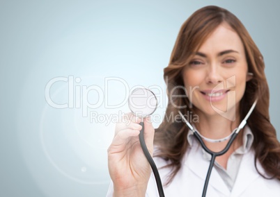 Portrait of smiling doctor showing stethoscope