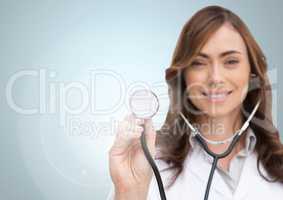 Portrait of smiling doctor showing stethoscope
