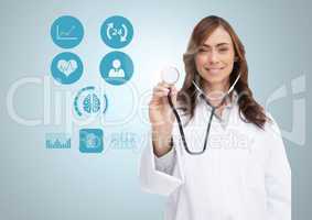 Portrait of smiling doctor showing stethoscope with icons on digital screen
