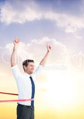 Businessman winning the race against sky in the background