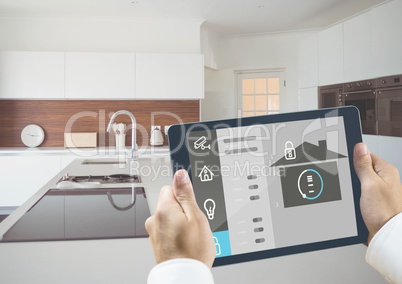 Man holding a digital tablet with home security concept