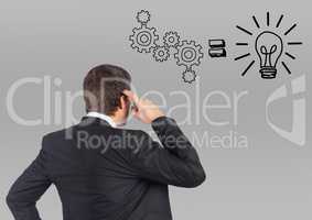 Businessman thinking and looking at graphics concept