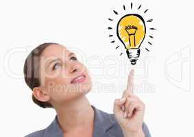 Woman looking at graphic light bulb