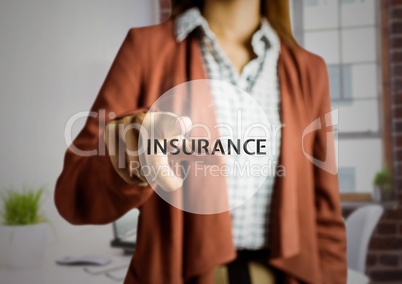 Businesswoman touching digitally screen with text insurance