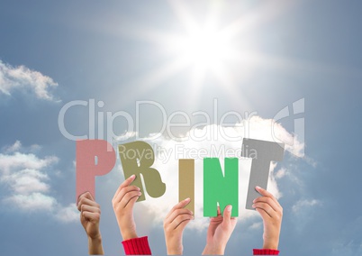 Hands holding word Print against bright sunlight