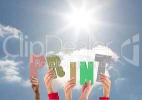 Hands holding word Print against bright sunlight