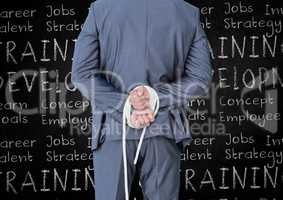 Rear view of businessman with his hands tied with rope