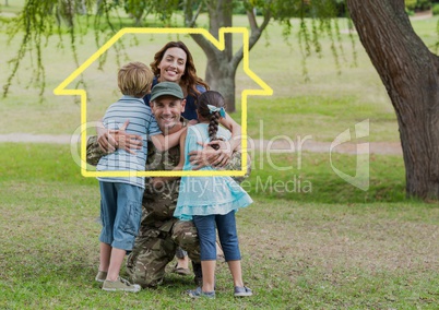 Family hugging each other in the park against house outline in background
