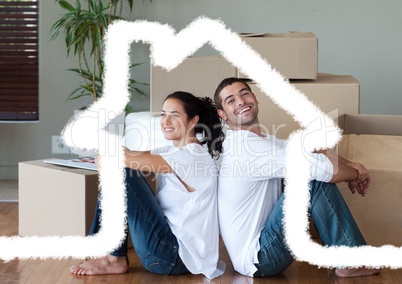 Couple sitting in living room against house outline in background