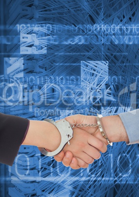 Business professionals shaking hands in handcuffs against coding background