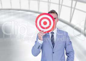 Businessman holding a target