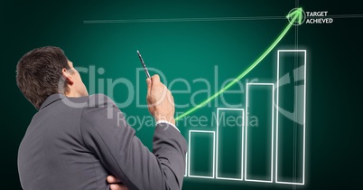 Digital composite image of businessman with business plan graph