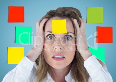 Frustrated businesswoman with sticky note stuck on her forehead