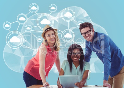 Portrait of happy man and women holding laptop with cloud computing concept in background