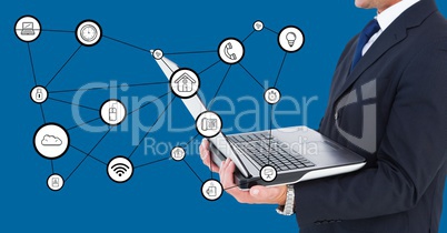 Businessman holding laptop with connecting icons