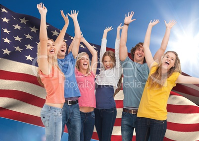 Group of young people cheering against American flag