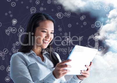 Happy woman holding digital tablet and connecting icons with cloud in background