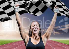 Athlete celebrating her victory with checkered flag on race track