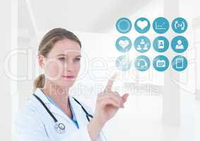 Doctor with stethoscope touching the digital icons