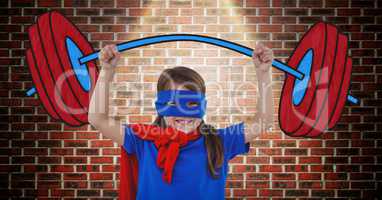 Girl in superhero costume pretending to lift weights against wooden background