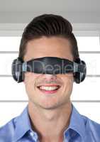 Smiling man using virtual reality glasses