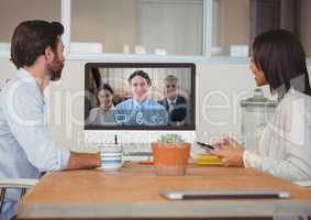 Business people having a video call with colleague on computer