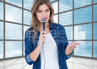 Female executive speaking over microphone in office