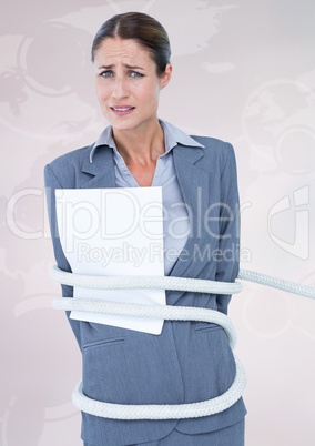 Businesswoman tied up with rope and paper against white background