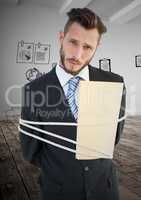 Portrait of businessman tied up with rope and folder