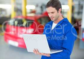 Automobile mechanic using laptop