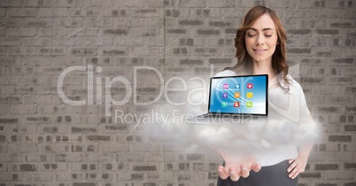 Conceptual image of woman holding cloud and laptop with various application icons