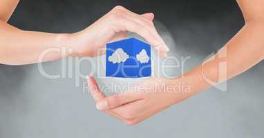 Hands gesturing against cloud computing icon in background
