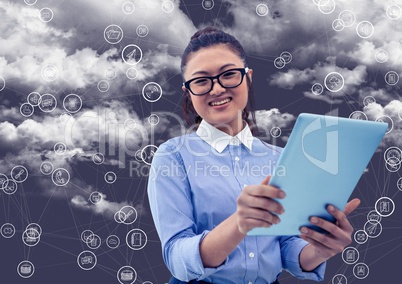 Portrait of woman holding digital tablet with connecting icons and cloud in background