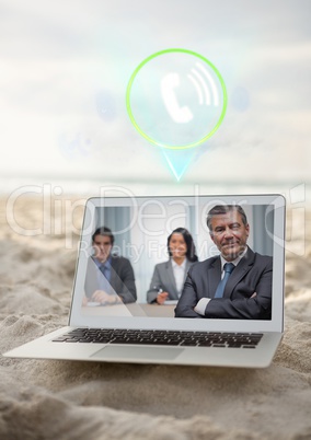 Laptop with video calling screen kept on sand at beach