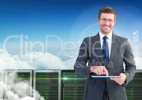 Businessman using digital tablet against database server systems in sky
