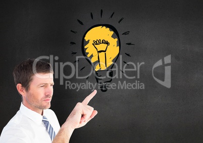 Digital composite image of businessman touching light blub
